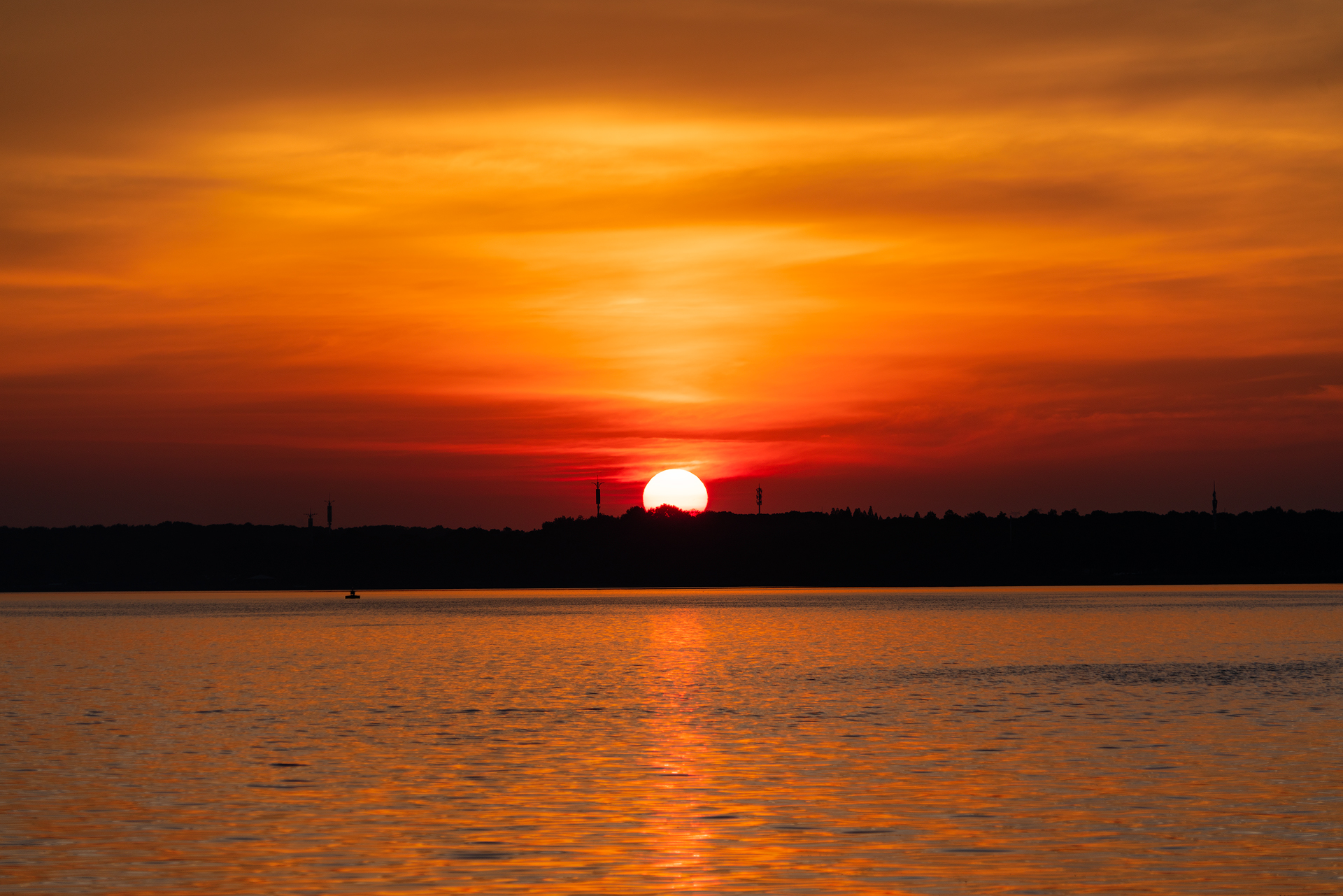 a brght sun cross from the horizen to the air